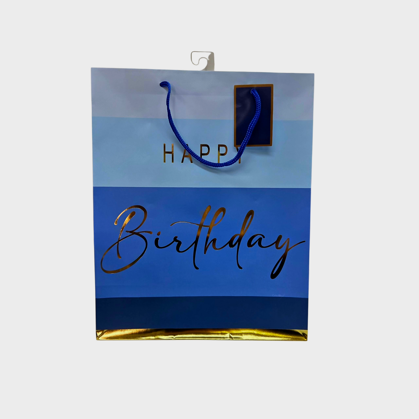 Blue gift bag in different hades f blue with gold foil print that reads happy birthday