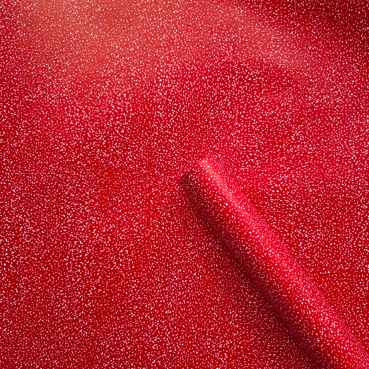 Red wrapping paper with white speckles