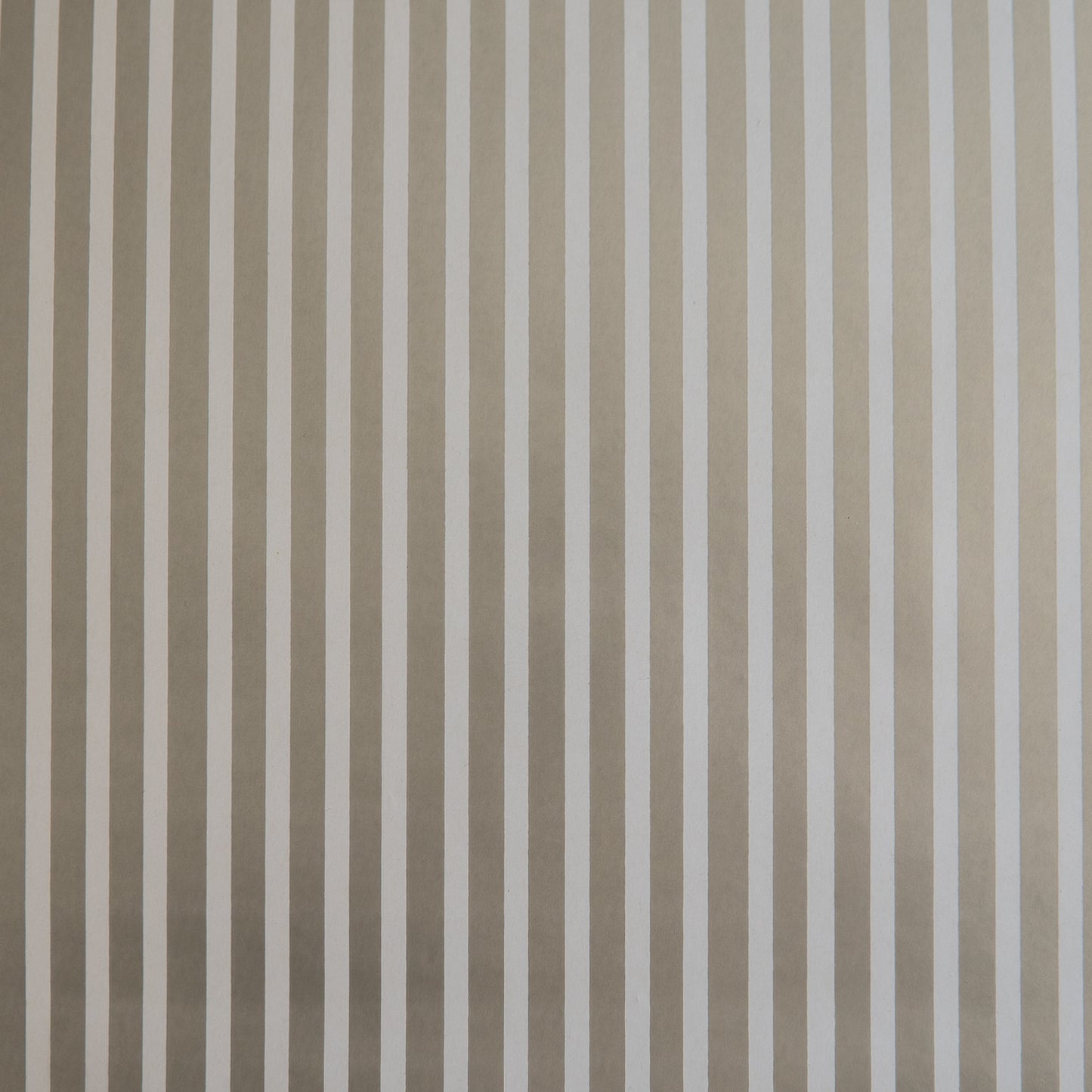 A close-up image of a silver and white striped wrapping paper texture.