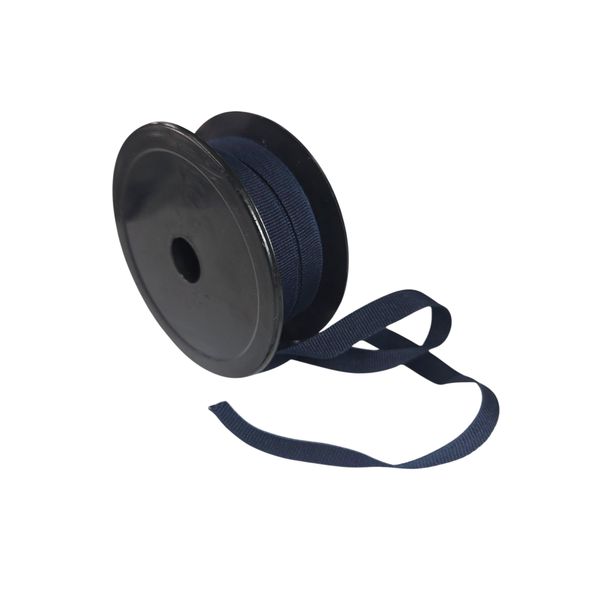 Spool of navy blue ribbon on a white background. 20 meter roll.