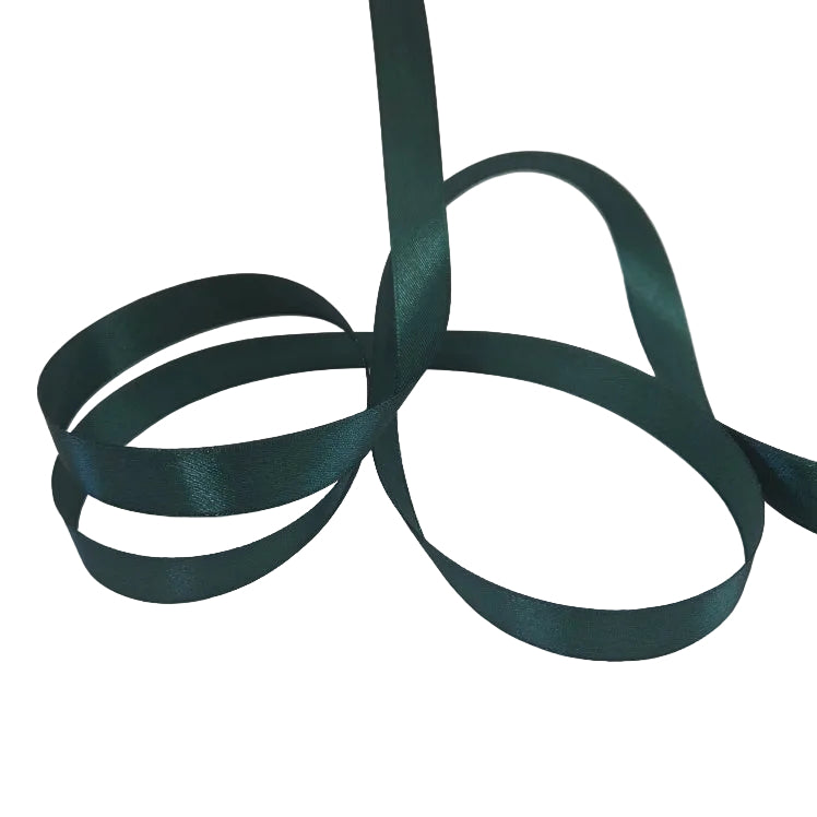 Green satin ribbon on a white background