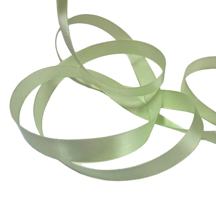 Light green satin ribbon on a white background