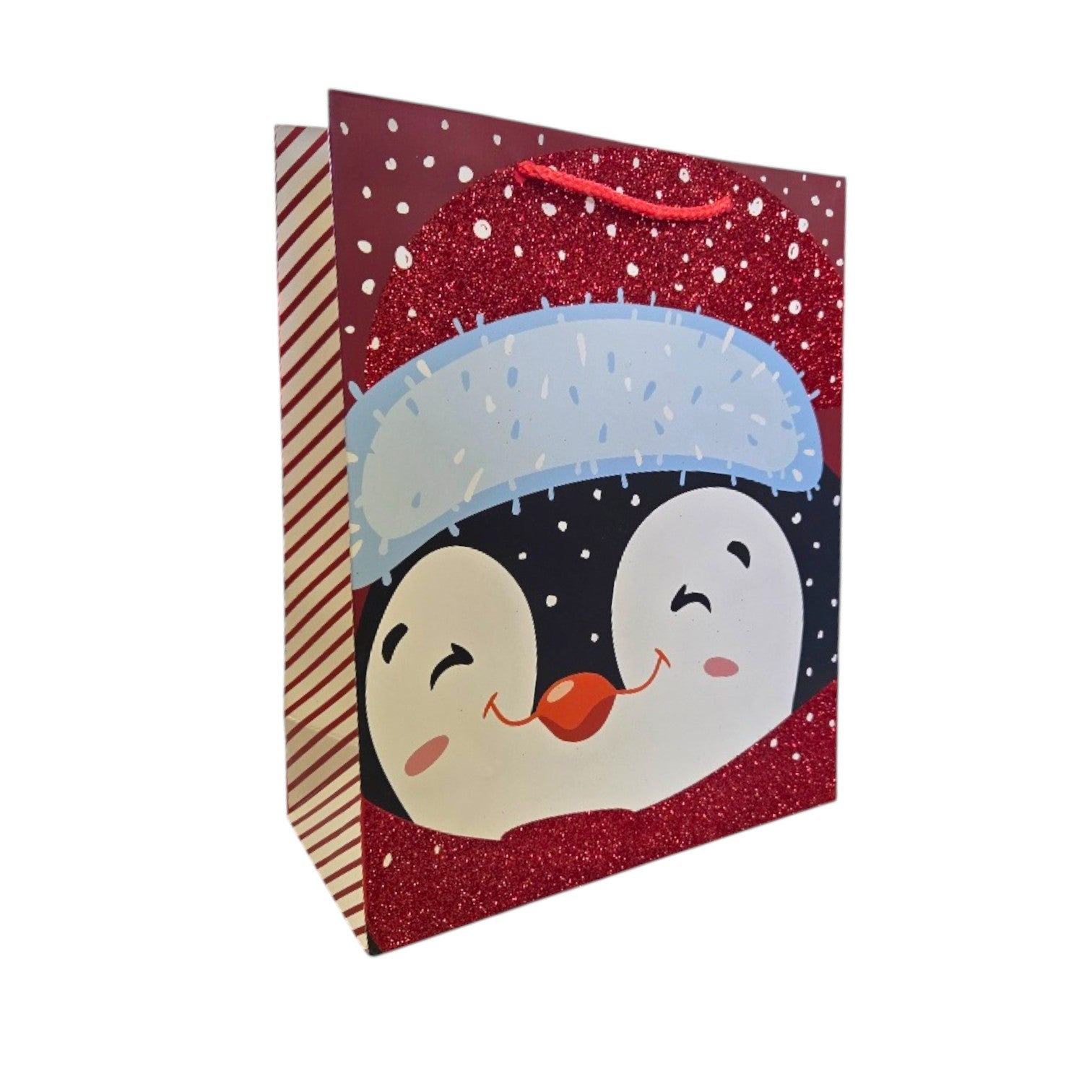 Gift bag with penguin design on a red glittery background