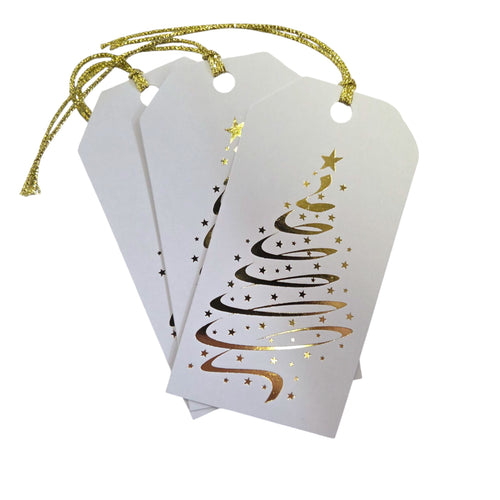White gift tags with gold foil Christmas tree design on a white background