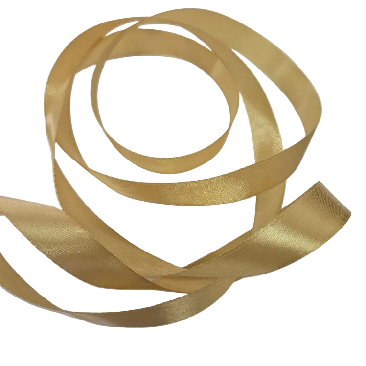Gold ribbon in a decorative swirl on a white background