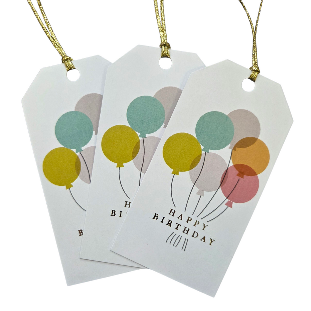 Three 'Happy Birthday' gift tags with colorful balloons on a white background