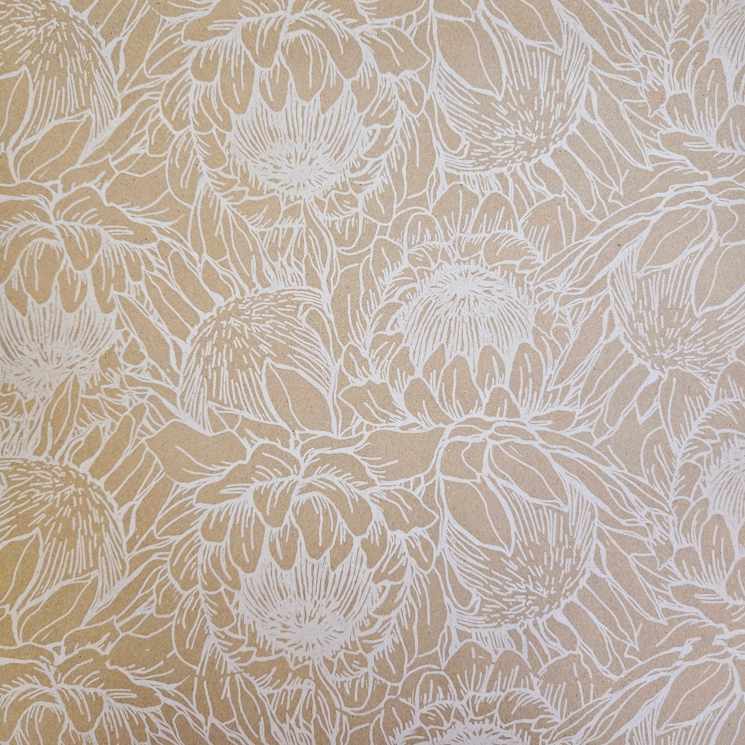  Kraft wrapping paper with a white protea floral pattern.