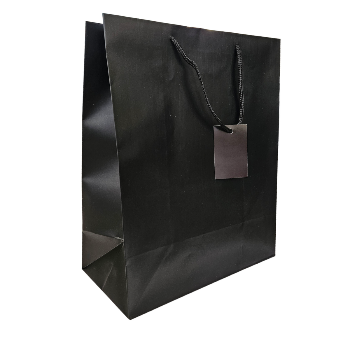 Black matt gift bag with a tag on a white background