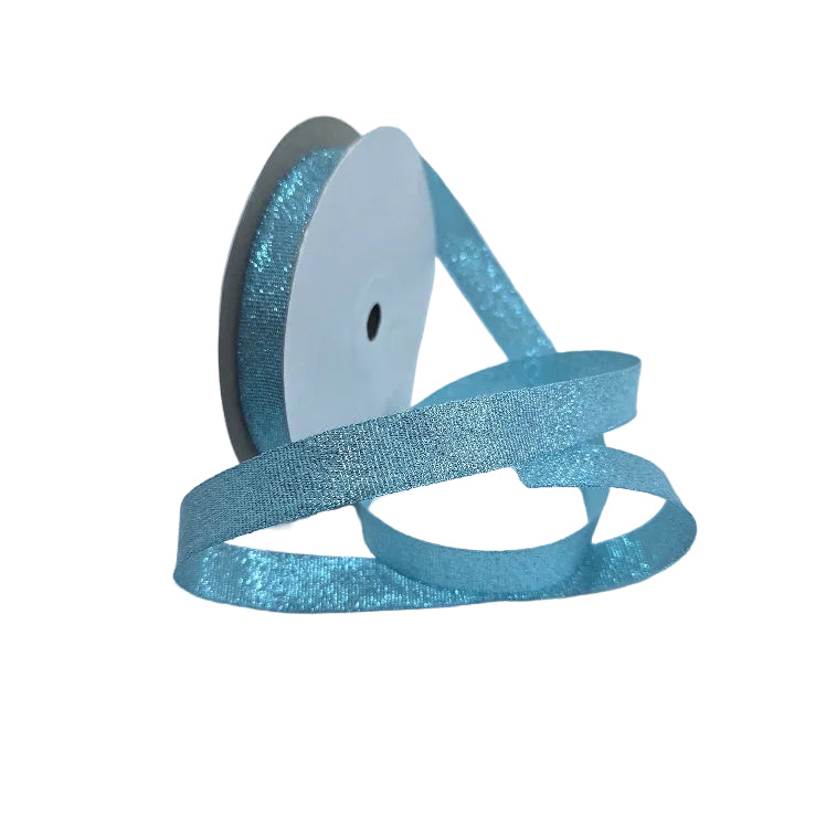 Spool of blue glitter ribbon on a white background
