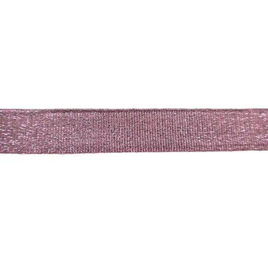 Pink glitter ribbon close up picture on a white background