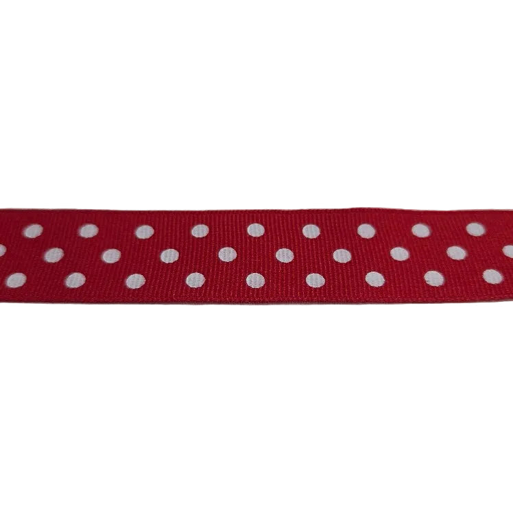 Red ribbon with white polka dots on a white background
