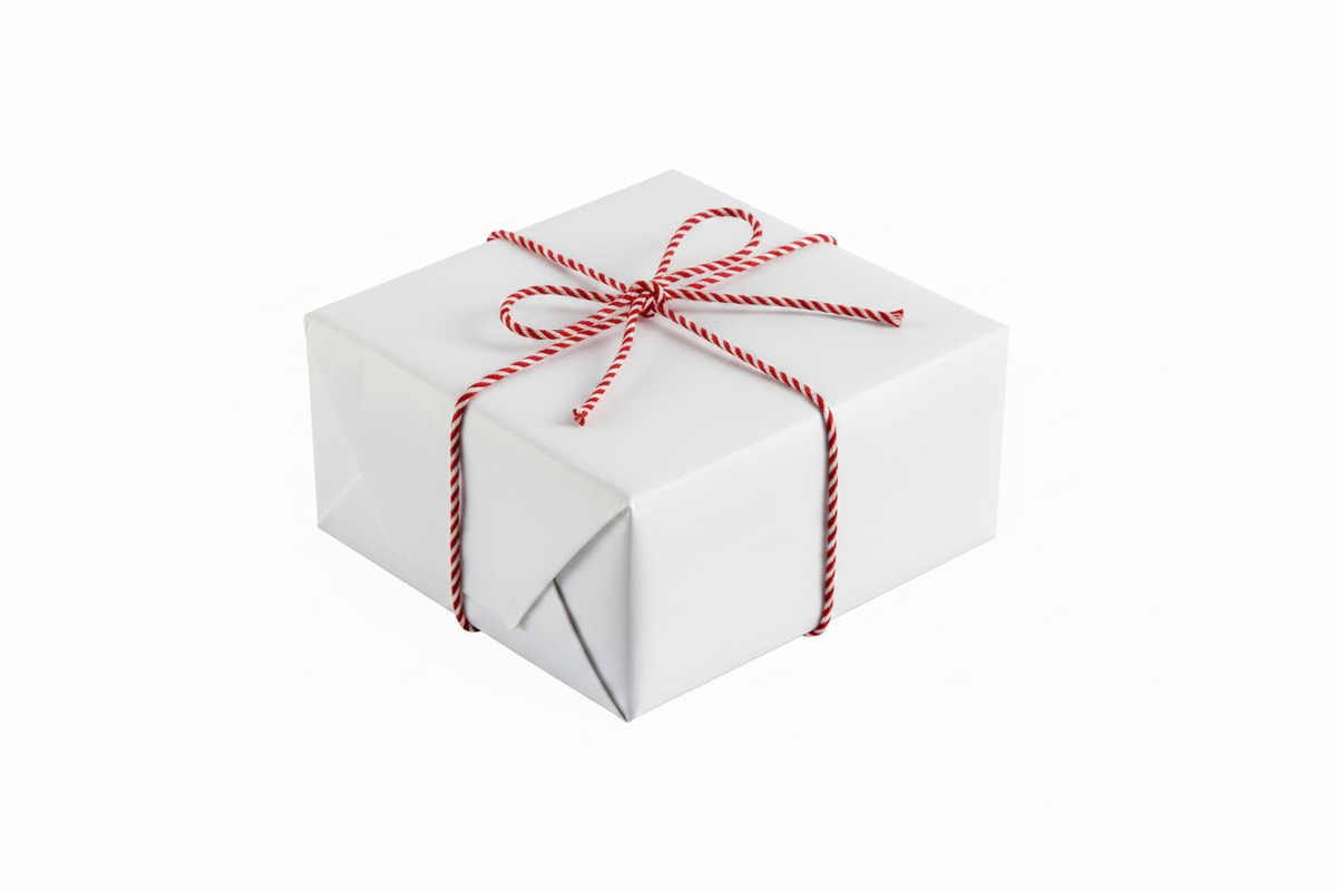 A white rectangular gift box wrapped with a red and white striped twine bow, isolated on a white background.