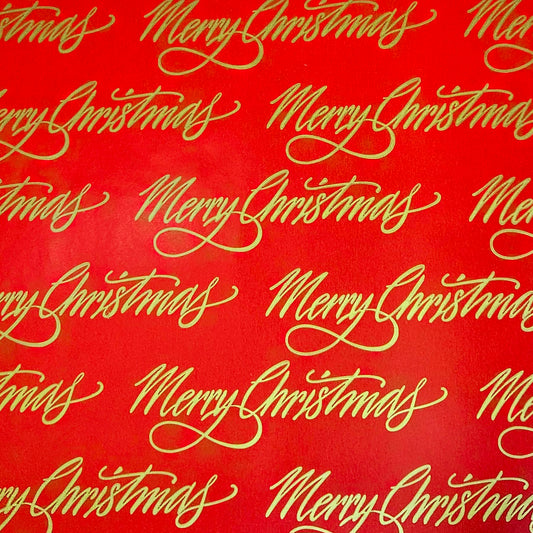 Red wrapping paper with Merry Christmas in gold print.