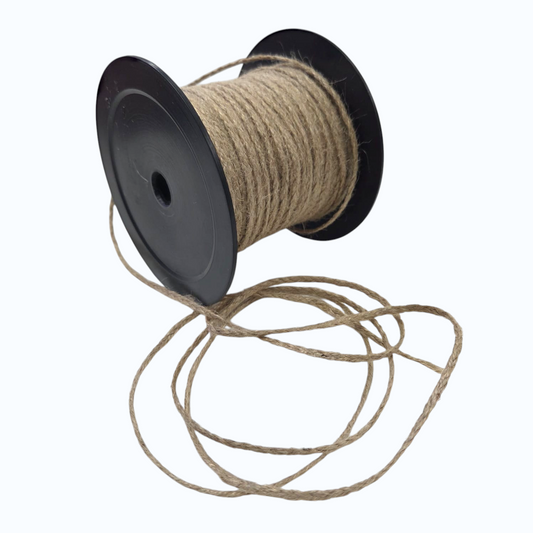 Spool of brown twine on a white background