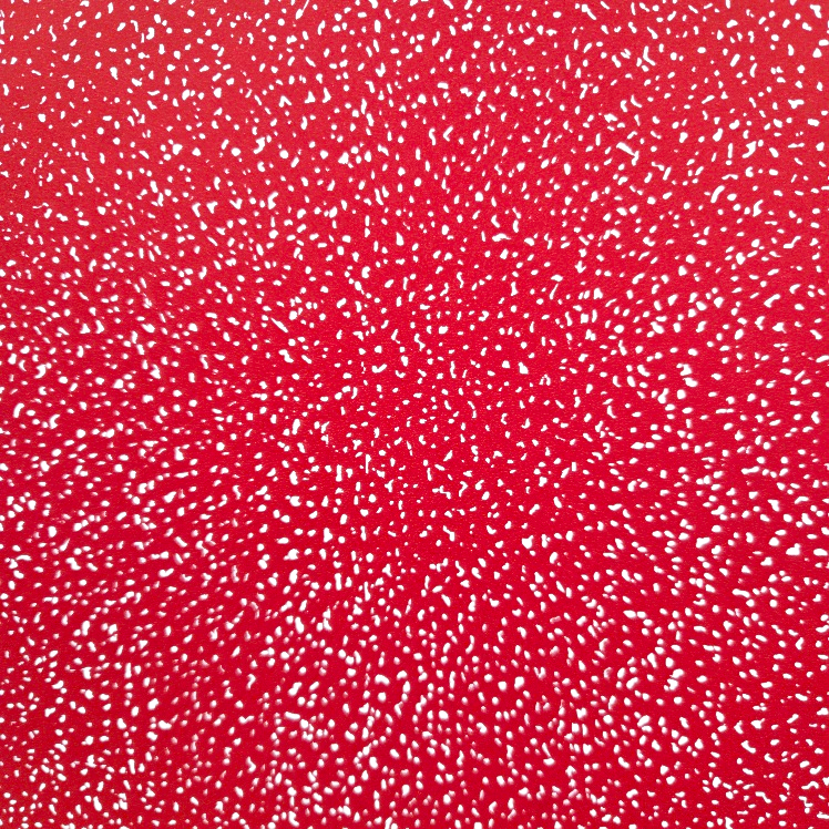 Red background with white speckle pattern