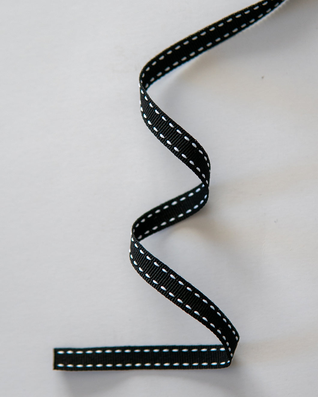 Black Petersham Ribbon with White Side Stitch. Width 10mm
