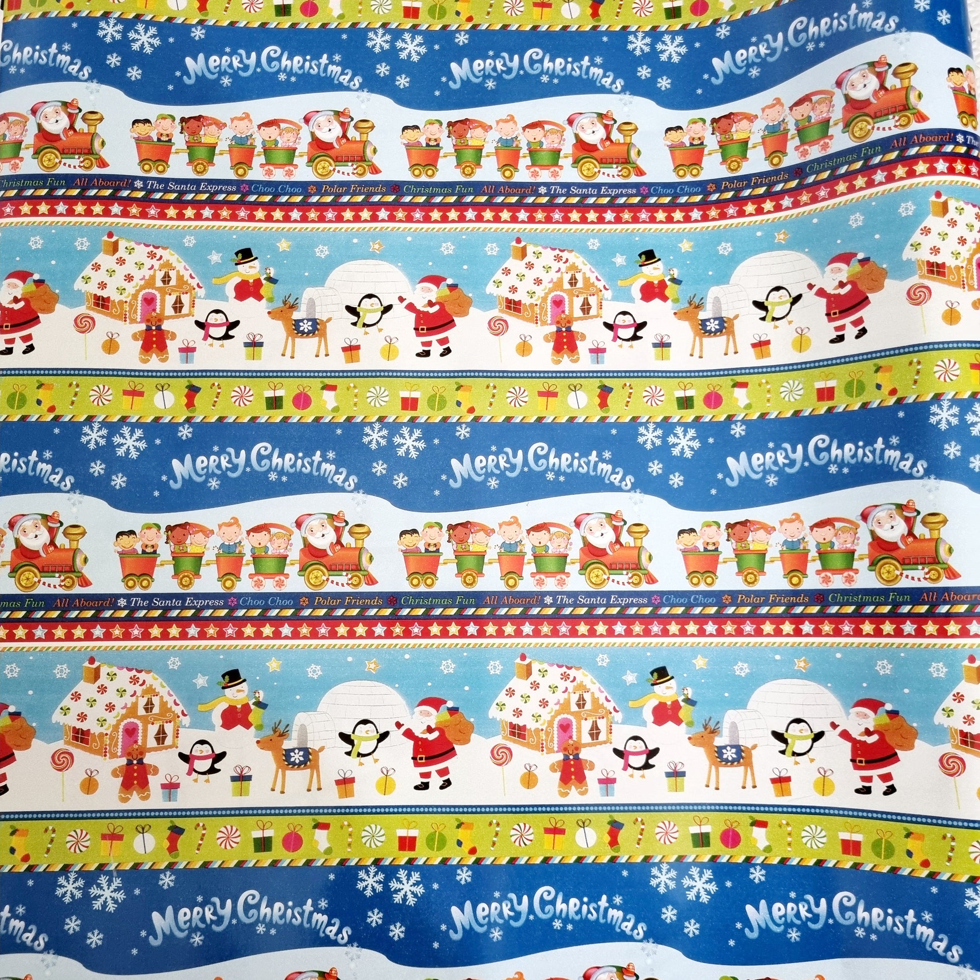 Christmas Wonderland Wrapping Paper, 10 meter x 600mm roll. Great for kids. Cartoon like Santa's with Snow men, penguins igloos snow flakes, Train with Gifts. 