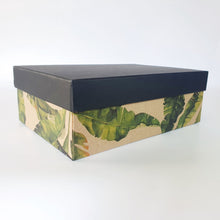 Load image into Gallery viewer, Rigid gift box.  tropical leaves on base with plain black lid.
