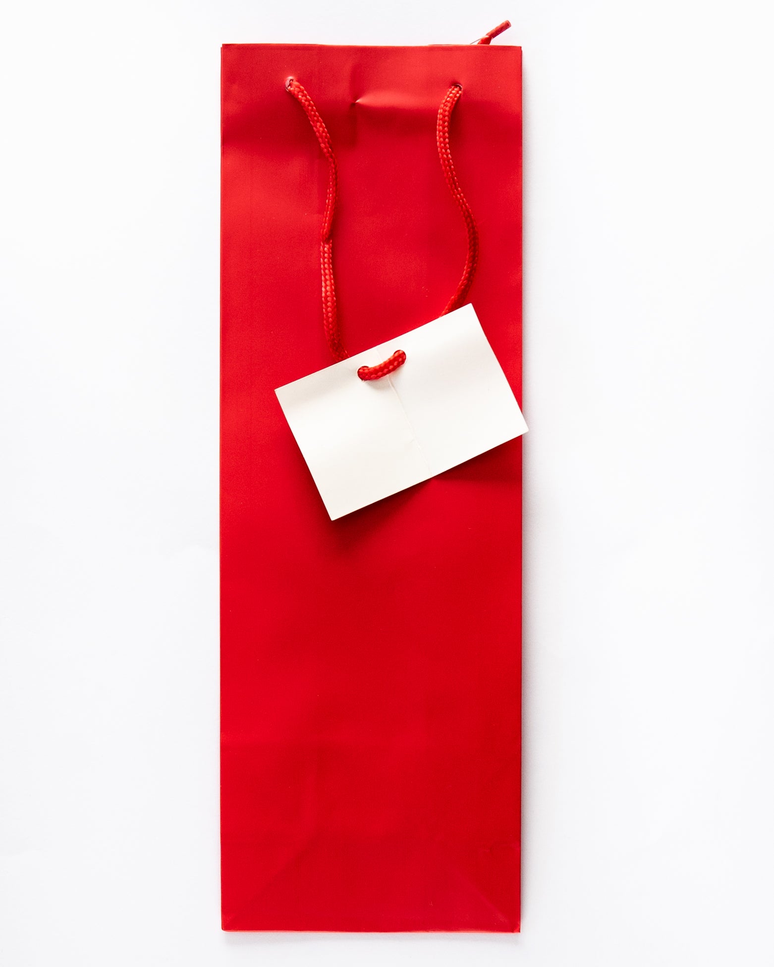 Red Bottle Bag with Cord Handle and Tag
