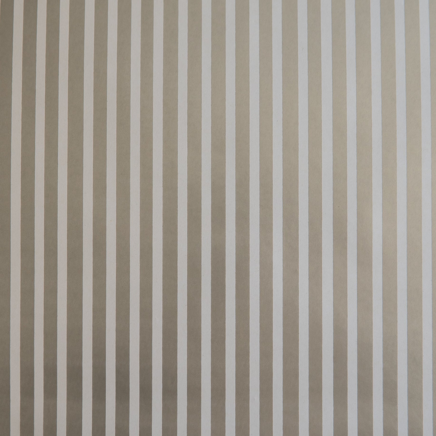 A close-up image of a silver and white striped wrapping paper texture.